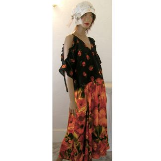 mannequin wearing peasant cold shoulder rose bud top with colorful rosey skirt and faded wrap hat